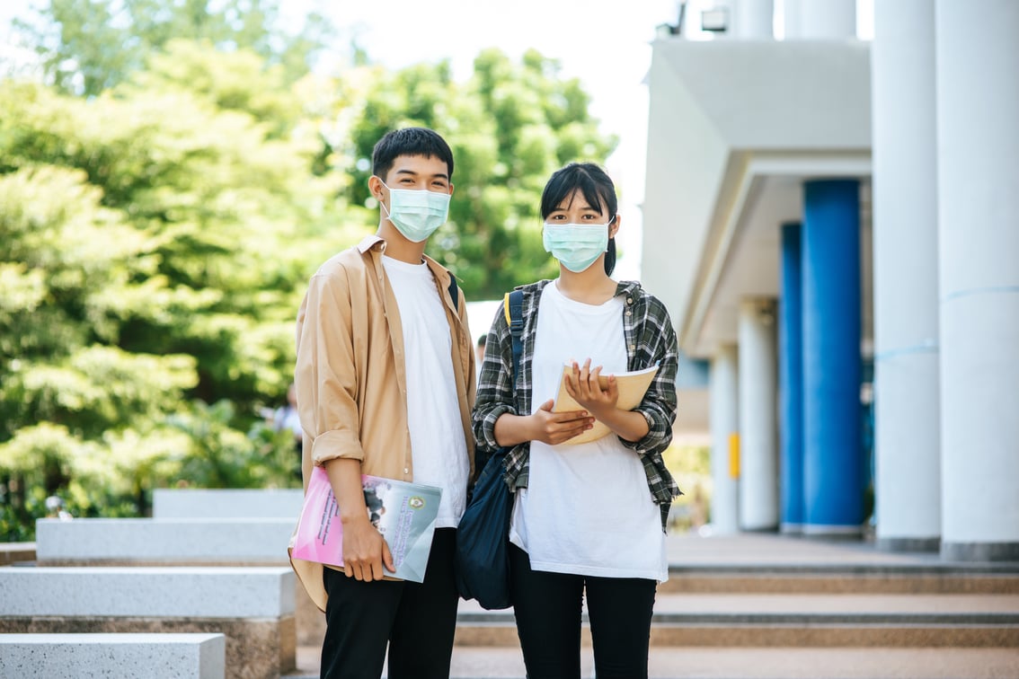 male-female-students-wear-health-mask-talk-each-other-stairs